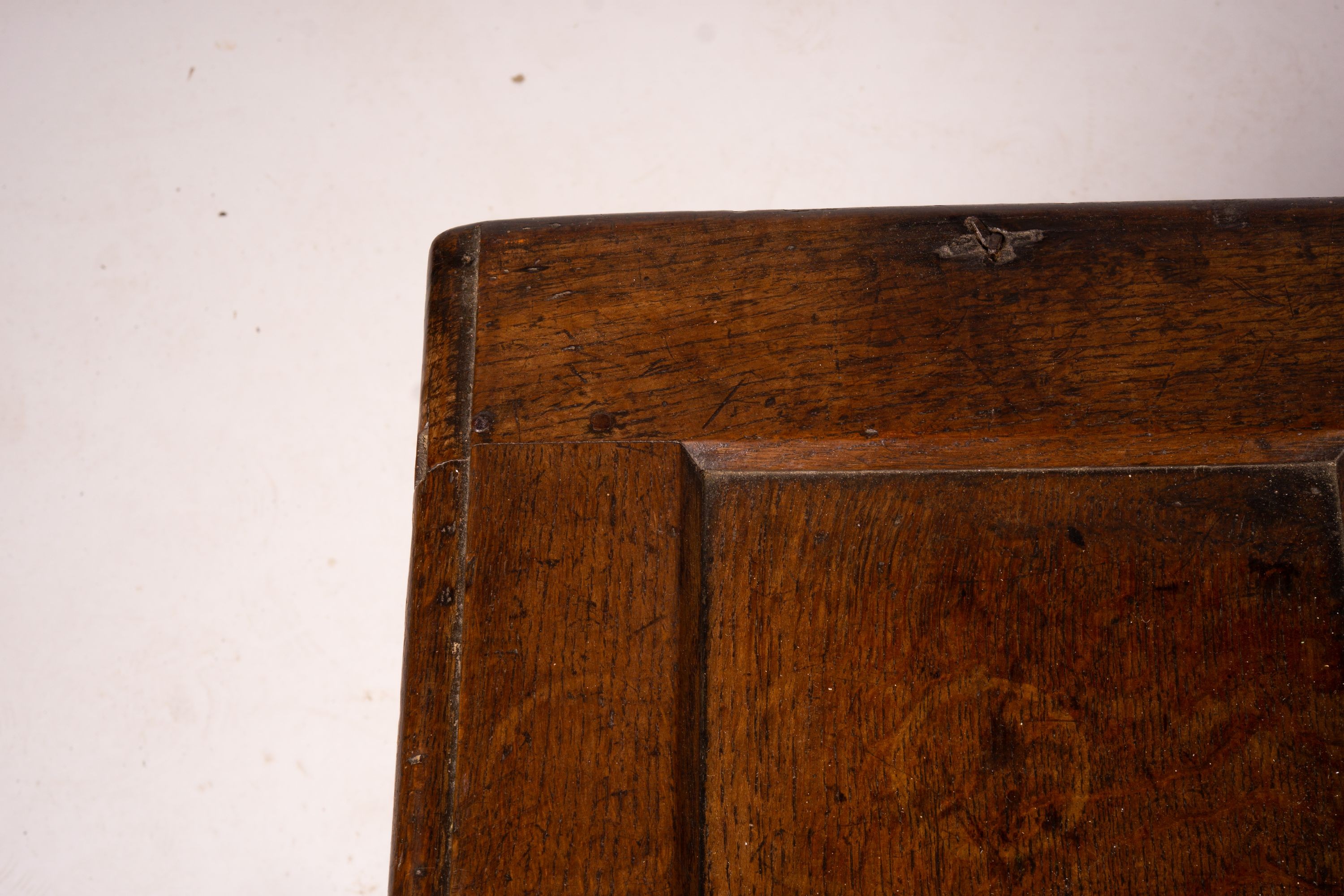 A 17th century panelled oak coffer, W.122cm D.55cm H.65cm